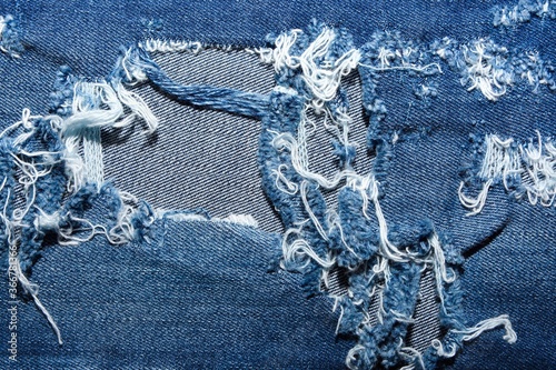 Fototapeta Naklejka Na Ścianę i Meble -  Background of darned jeans in high quality