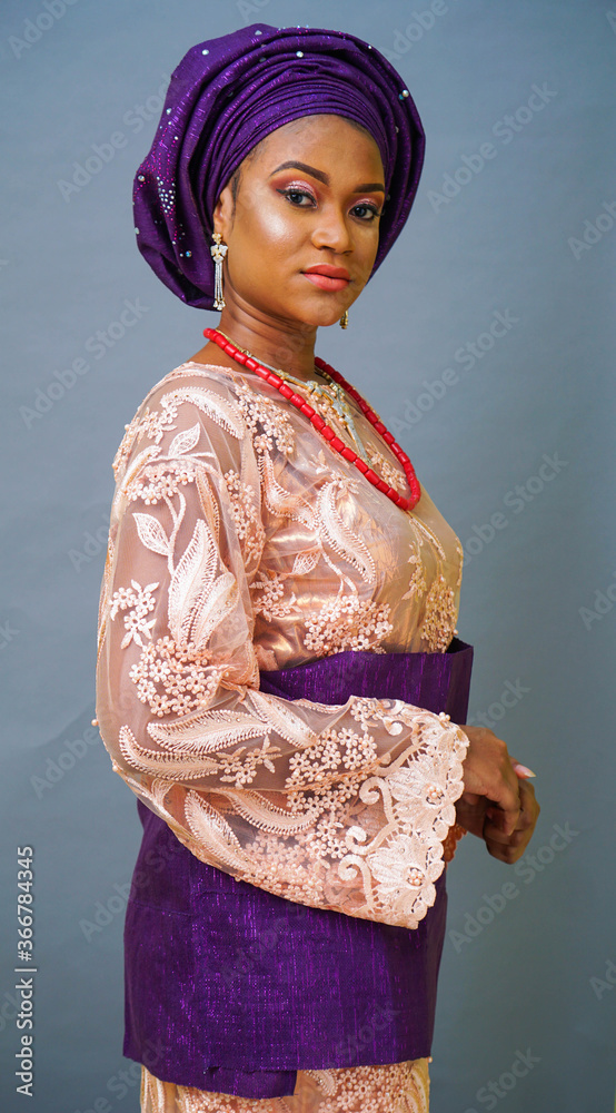 Portrait of beautiful African bride dressed in Nigerian traditional dress Portrait of beautiful African bride dressed in Nigerian traditional dress