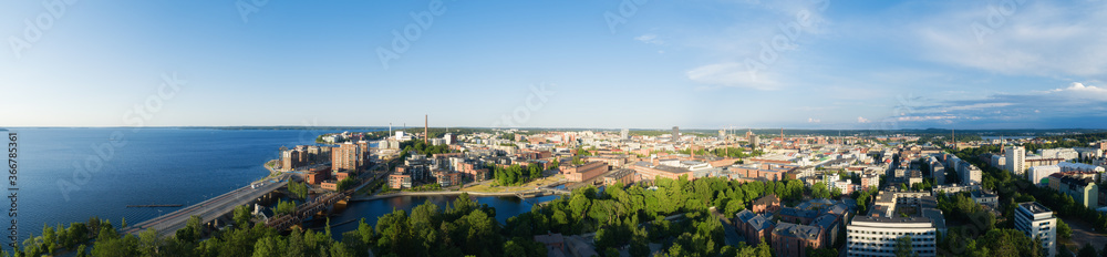 Beautiful summer panorama of Tampere city at sunset. Blue sky and clouds.  Finland.