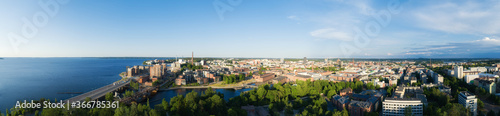 Beautiful summer panorama of Tampere city at sunset. Blue sky and clouds.  Finland.