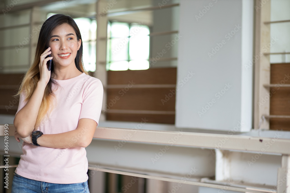 Asian women are using their mobile phones to communicate over the internet. Asian women are using their mobile phones to communicate over the internet.