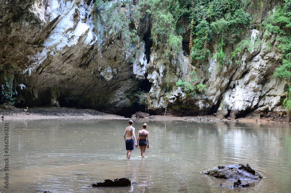 People outdoor exploring the natural surroundings in Railay, Krabi, Thailand People outdoor exploring the natural surroundings in Railay, Krabi, Thailand