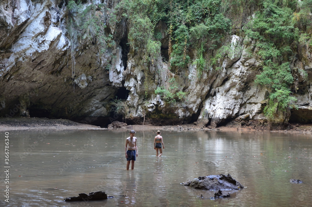 People outdoor exploring the natural surroundings in Railay, Krabi, Thailand People outdoor exploring the natural surroundings in Railay, Krabi, Thailand