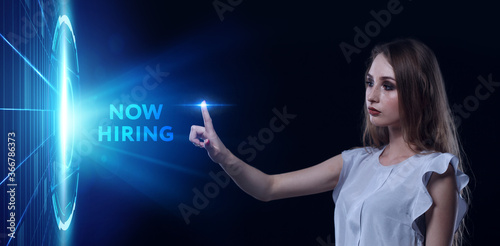 Business, Technology, Internet and network concept. Young businessman working on a virtual screen of the future and sees the inscription: Now hiring