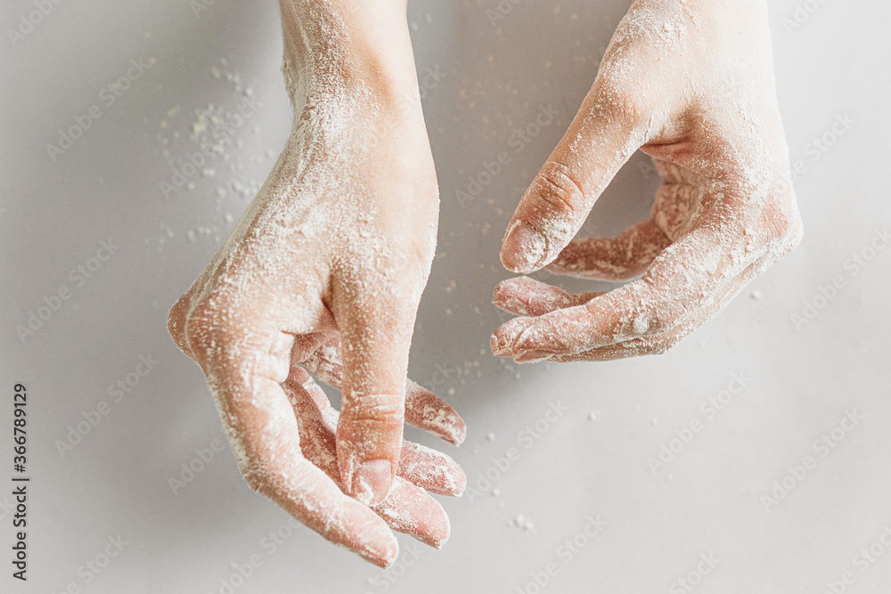 Fototapeta premium woman hands in flour 