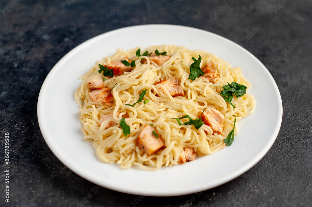 pasta with salmon on a stone background
pasta with salmon on a stone background