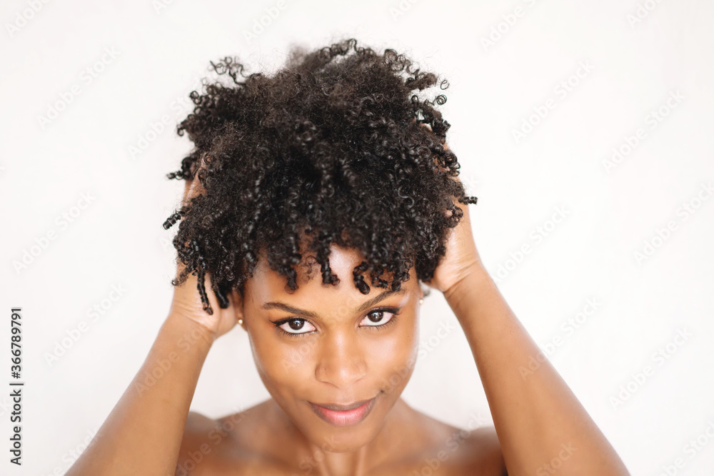 Young black woman with afro hair portrait Young black woman with afro hair portrait