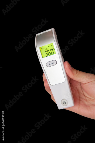 Wallpaper Mural Digital Thermometer for check forehead temperature screening from Coronavirus Pandemic 2019 (covid 19). Isolated on black background. Torontodigital.ca