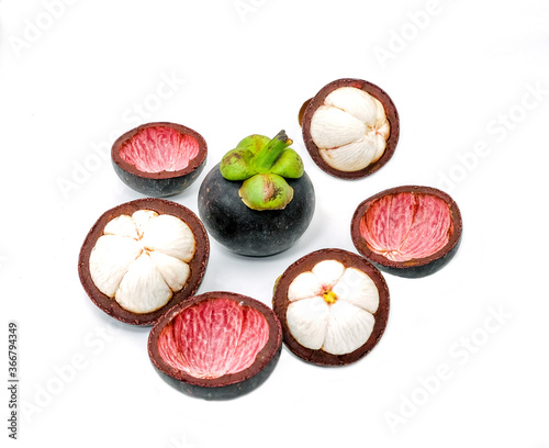 group organic mangosteen fruit . cut half peel sweet violet and green color dessert in summer season thailand. multivitamin juicy freshness vegetarian. Isolated on white background