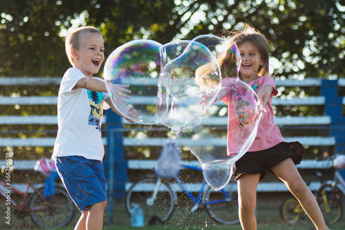 children playing with soap bubbles