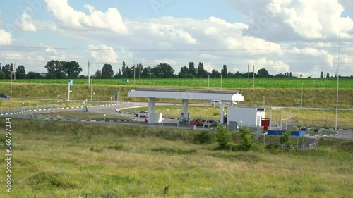 a lone gas station stands outside the city photo