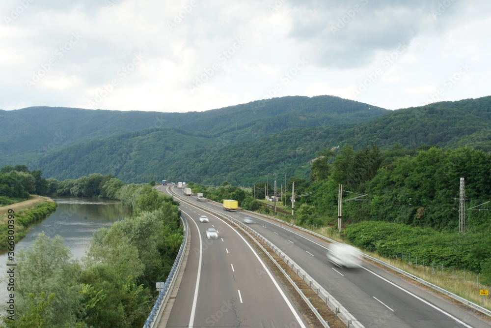 Aerial view of highway R1 in Zarnovica,  Slovakia direction Nitra with river Hron on the left hand side. The region is surrounded by Stiavnica Mountain range.