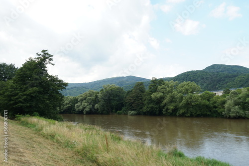 River basin of river Hron with artificially elevated bank serving as a anti flood barrier. Region Zarnovica in Slovakia. photo