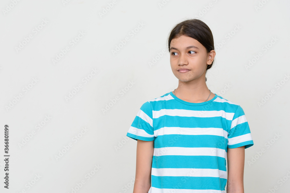 Portrait of young Asian teenage girl against white background Portrait of young Asian teenage girl against white background