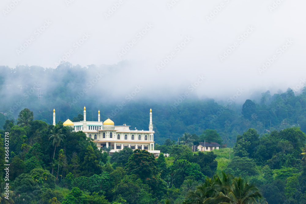 Beautiful mosque in the hill surrounded by forest