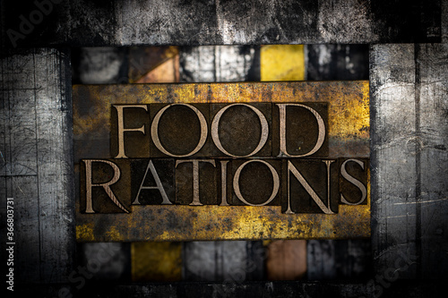 Food Rations text formed with real authentic typeset letters on vintage textured silver grunge copper and gold background