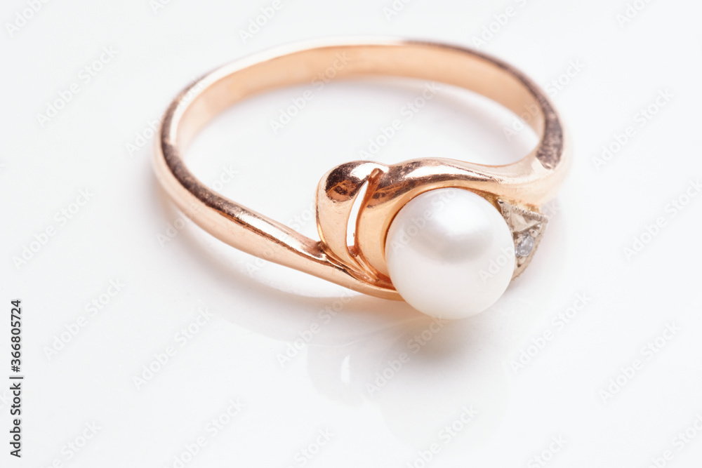 Golden ring with pearl, macro