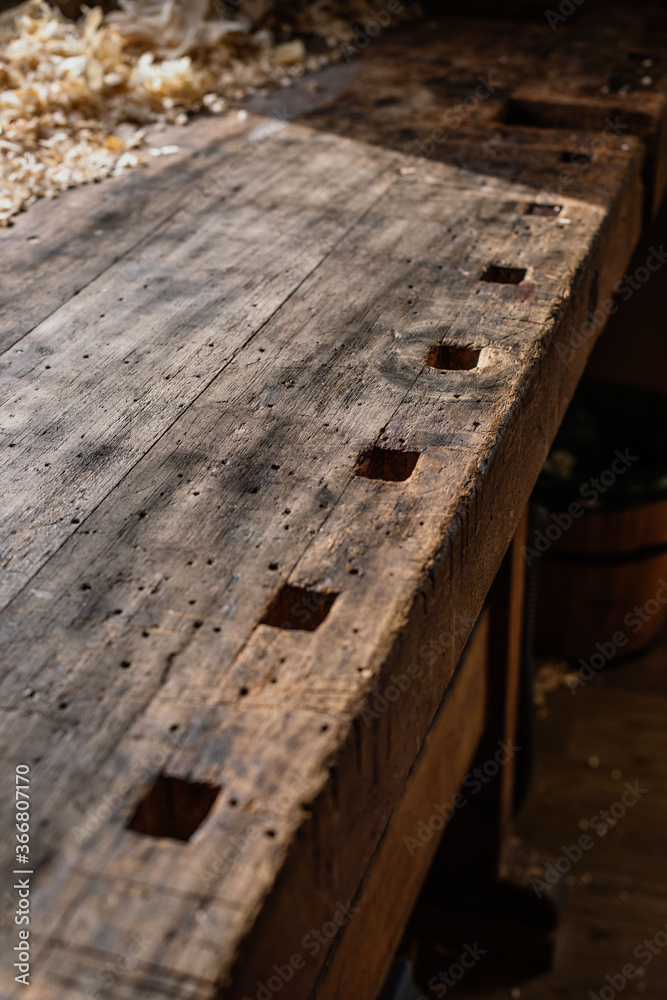 High angle of wooden shabby template with marking square shaped holes for crafting violin details in workroom High angle of wooden shabby template with marking square shaped holes for crafting violin details in workroom