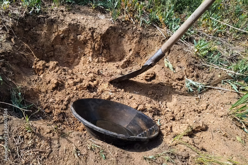 plate for rinsing rock in search of gold.