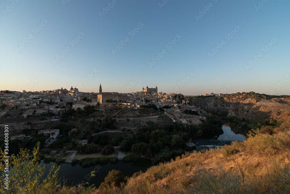 Aerial view of aged town with medieval houses located on shore of river Aerial view of aged town with medieval houses located on shore of river