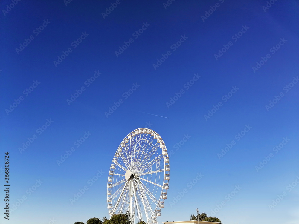 Ferris wheel on a blue sky Ferris wheel on a blue sky