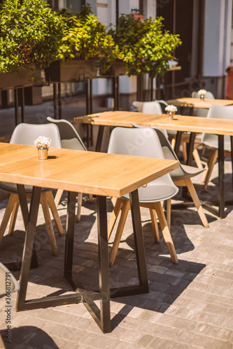 Outdoor cafe terrace with wooden furniture © Christina