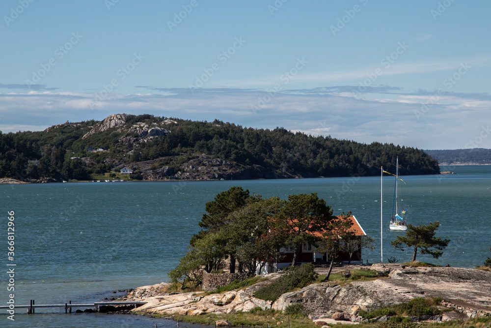 View of the Swedish archipelago with a sailing boat