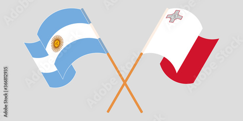 Crossed and waving flags of Malta and Argentina