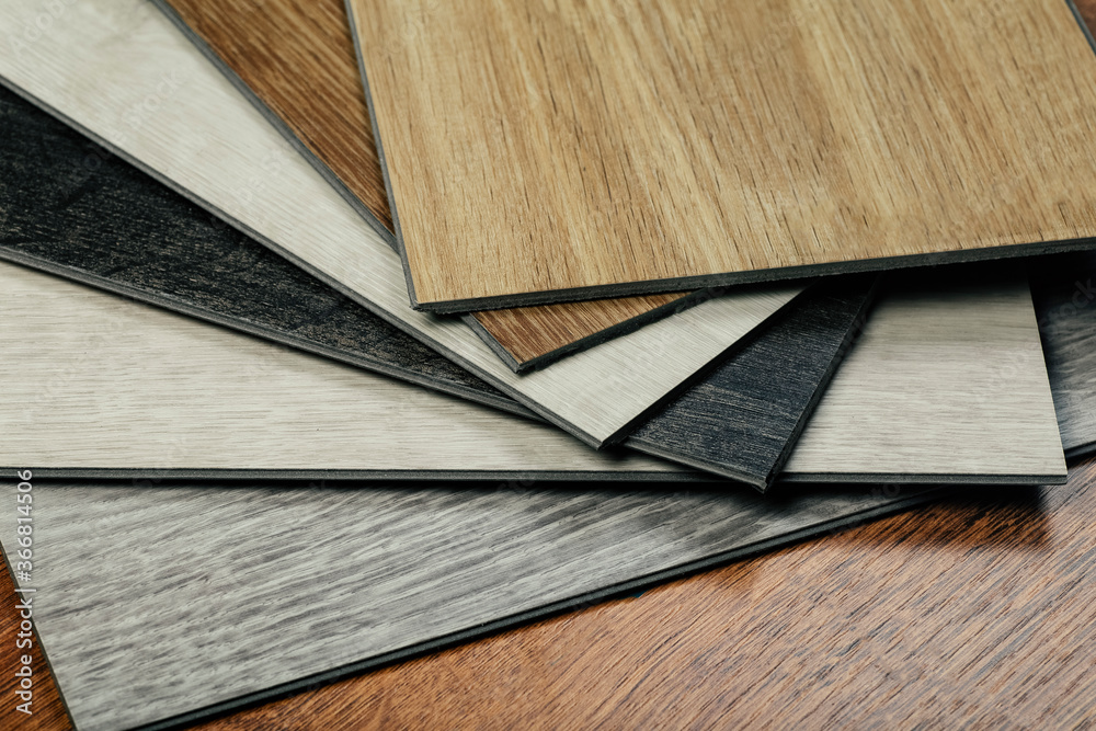 Laminate background. Samples of laminate or parquet with a pattern and wood texture for flooring and interior design. Production of wooden floors Laminate background. Samples of laminate or parquet with a pattern and wood texture for flooring and interior design. Production of wooden floors