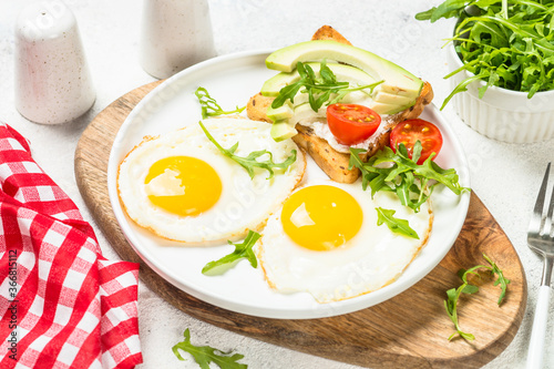 Healthy breakfast with egg  toast and salad.