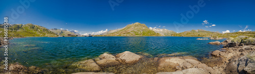 Panorama alps pass with lake in summer