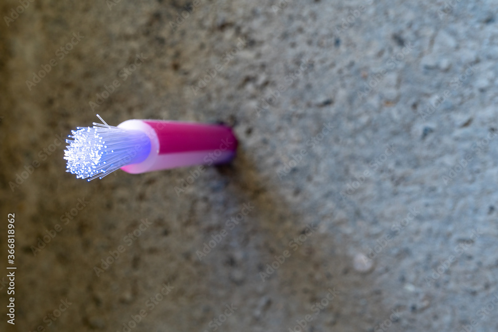 Optical fibre cable for communication in a hole drilled through concrete.