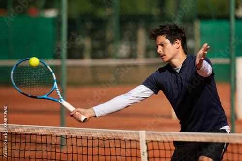 tennis player on the clay tennis court © kevin