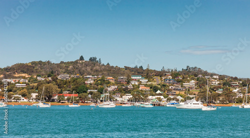 Fototapeta Naklejka Na Ścianę i Meble -  View of Russell in Bay of Islands with residential buildings and boats  - Panorama in Northland, North Island, New Zealand