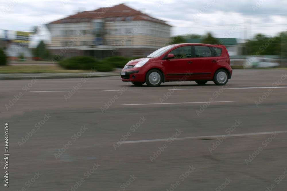 city traffic motion blurred passenger car in motion