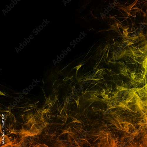 Abstract color smoke on black background, orange smoke background