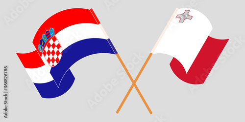 Crossed and waving flags of Malta and Croatia