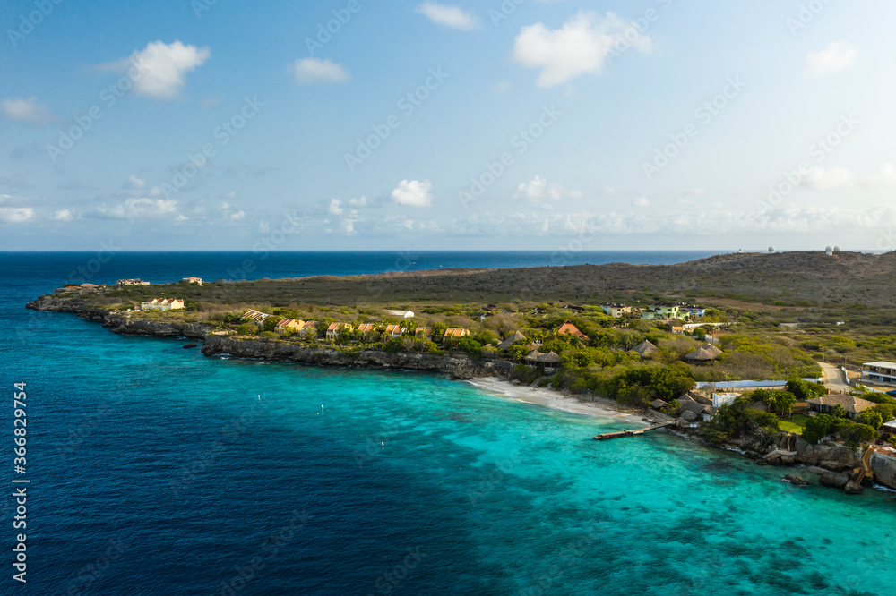 Aerial view of coast of Curaçao in the Caribbean Sea with turquoise water, cliff, beach and beautiful coral reef Aerial view of coast of Curaçao in the Caribbean Sea with turquoise water, cliff, beach and beautiful coral reef