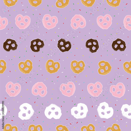 chocolate pretzel and sprinkles seamless pattern on purple background design