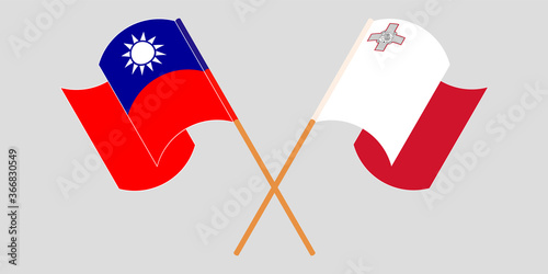 Crossed and waving flags of Malta and Taiwan