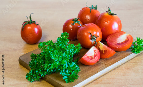 tomatoes with parsley on the plank