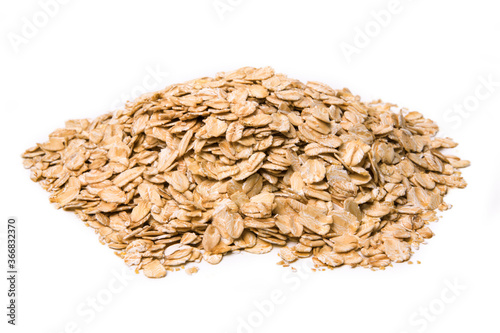 Oat flakes close-up isolated on white. Texture