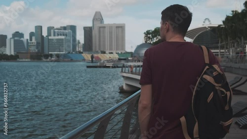 walking tourist on embankment in Singapore