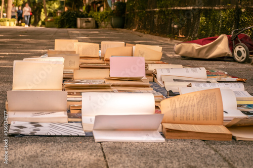 old books waiting to be sold on the street