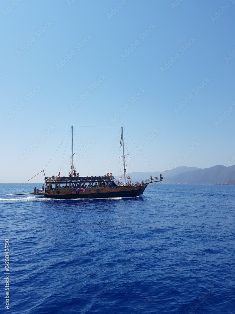 Pirate ship sails the sea, landscape, mountains Pirate ship sails the sea, landscape, mountains