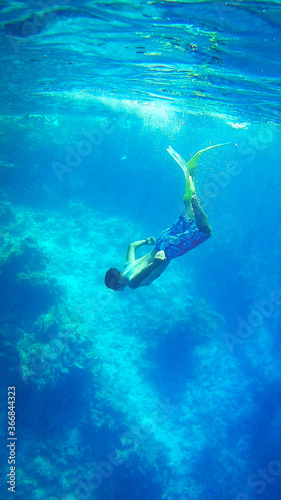 free diver underwater on the Red Sea, snorkeling, diving