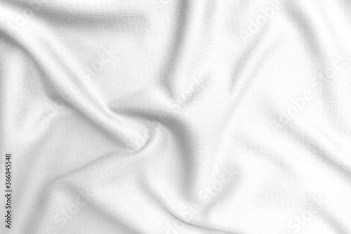 Abstract white fabric texture background. Wavy white cloth.