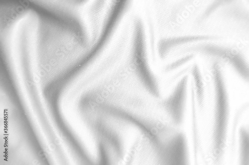 Abstract white fabric texture background. Wavy white cloth.