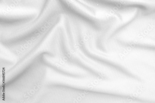 Abstract white fabric texture background. Wavy white cloth.