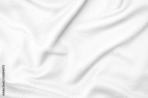 Abstract white fabric texture background. Wavy white cloth.